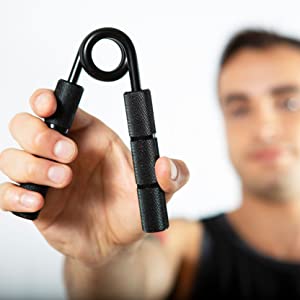 a man holding the powergripper for bjj grip training